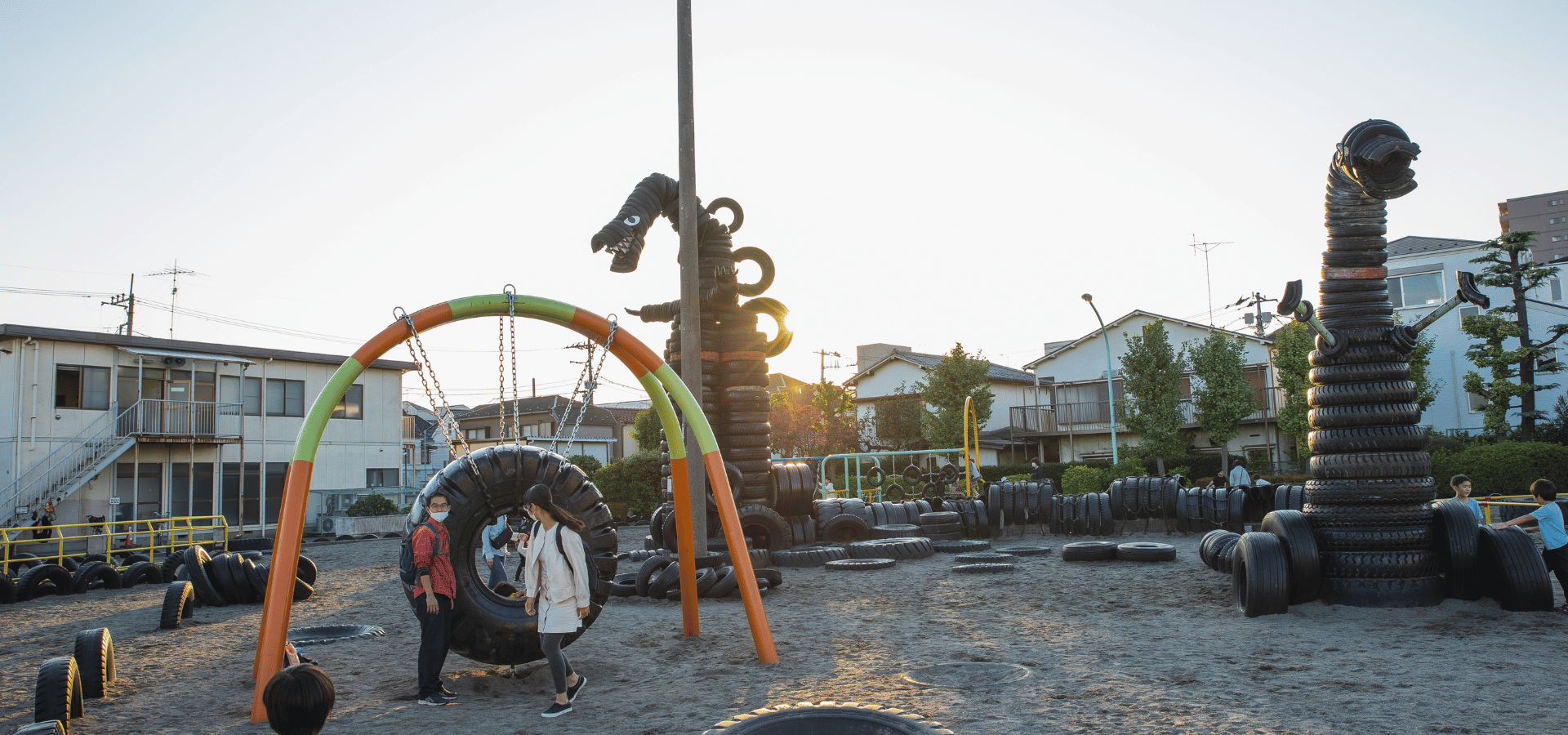 Tire Upcycling Park and Dinosaur Sculptures Demonstrating Community Impact